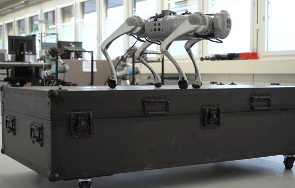 a four legged robot standing on top of a box